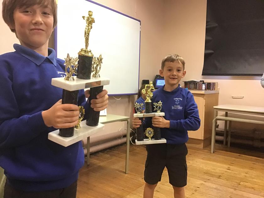 Hugo and Henry won trophies for BMX riding at a competition